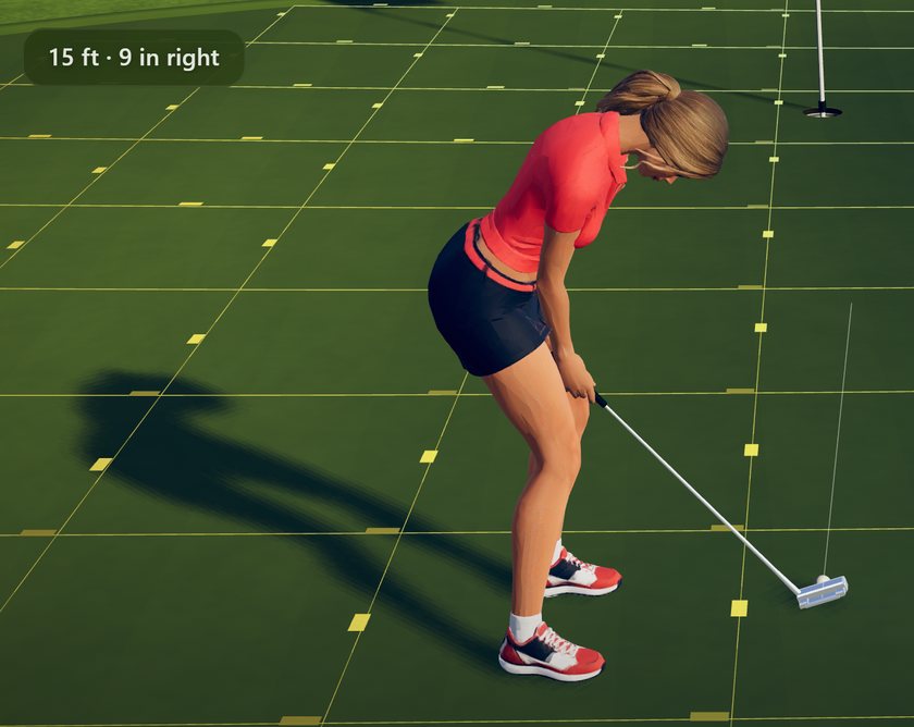 The read, up close: 15 feet, 9 inches right, the golfer over the ball on the slope grid with the cup ahead